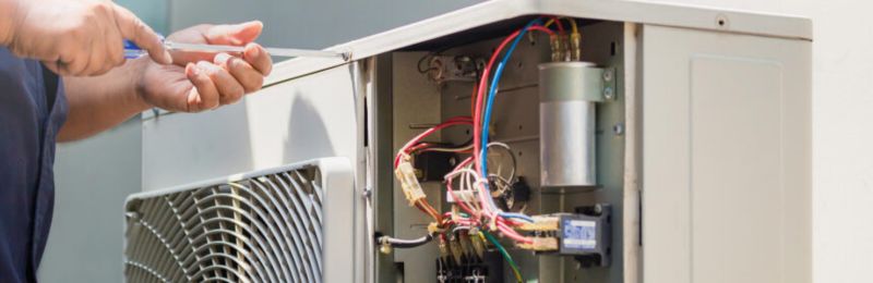 Furnace technician repairing a heating system in Cardiff by the Sea CA